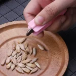 تخمه پوست کن دستی